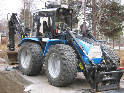 Bild på HUDDIG traktorgrävare